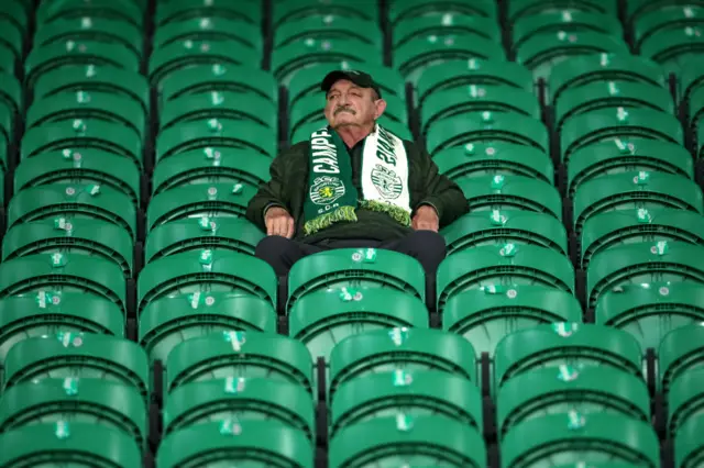 A man watches Sporting warm up on his own