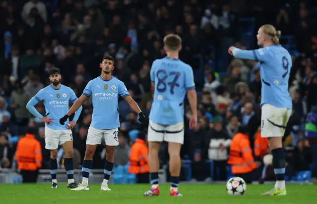 Manchester City players looking dejected