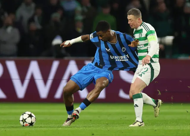 Club Brugge's Raphael Onyedika in action with Celtic's Callum McGregor