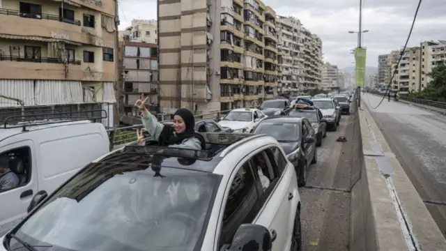 Displaced residents return to their homes by vehicles after the ceasefire agreement between Israel and Lebanon comes into effect in Dahieh region of Beirut