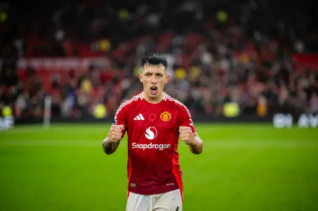 Lisandro Martinez celebrates on the pitch at Old Trafford