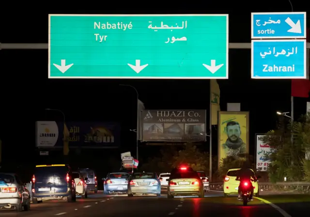 Vehicles drive south from Zahrani