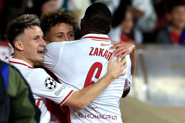 Monaco's Moroccan midfielder #07 Eliesse Ben Seghir celebrates with Monaco's Russian midfielder #10 Aleksandr Golovin (L) after scoring his team's first goal during the UEFA Champions League, league phase day 5, football match between AS Monaco and SL Benfica at the Stade Louis-II in Monaco