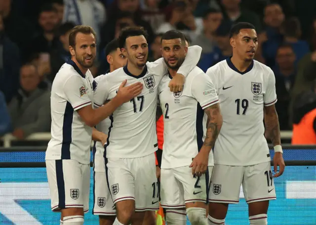 Curtis Jones celebrates scoring on his England debut with Harry Kane (left), Kyle Walker and Morgan Rogers.