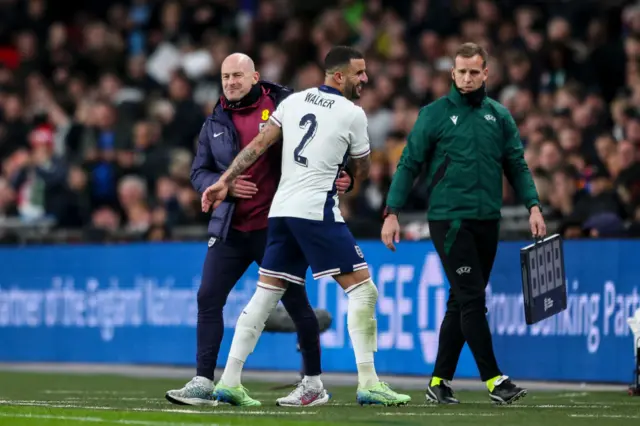 England interim manager Lee Carsley embraces defender Kyle Walker.