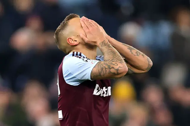 Lucas Digne of Aston Villa reacts after missing a chance