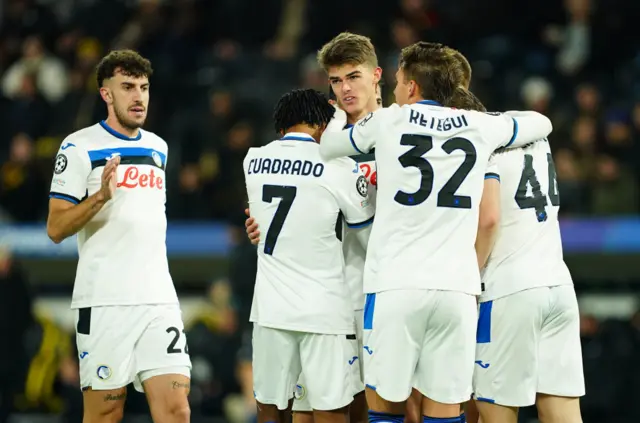 Charles de Ketelaere celebrates with Atalanta teammates after scoring against Young Boys