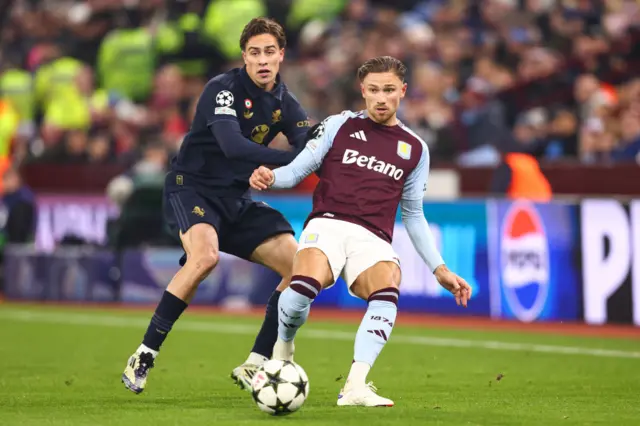 Kenan Yildiz of Juventus and Matty Cash of Aston Villa in action.