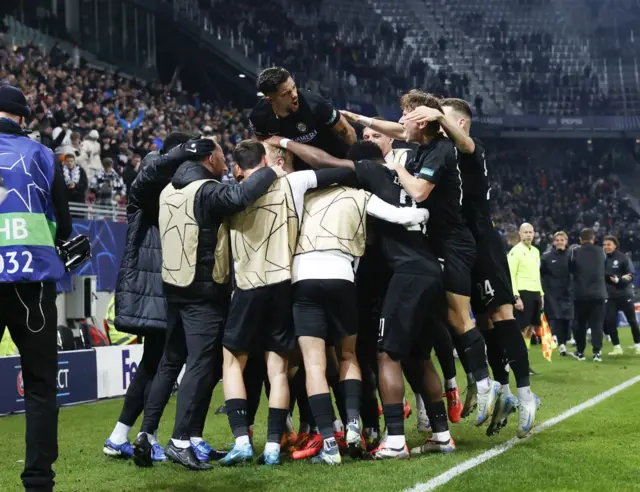 Sturm graz players celebrate their goal v Girona