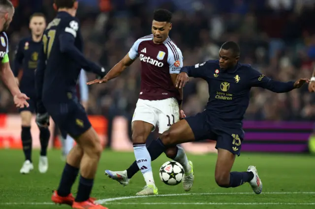 Pierre Kalulu vies with Aston Villa's English striker Ollie Watkins