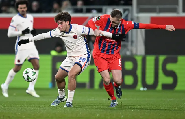 Marc Guiu (L) and Heidenheim's German defender #06 Patrick Mainka vie for the ball