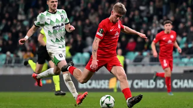 Larne's Dylan Sloan prepares to shoot on the Olimpija goal