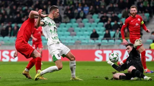 Raul Florucz is denied by outstretched Larne keeper Rohan Ferguson