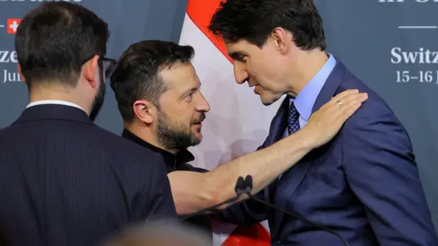 Ukraine's President Volodymyr Zelenskiy and Canada's Prime Minister Justin Trudeau talk during the closing press conference of the Summit on Peace in Ukraine, in Stansstad near Lucerne, Switzerland, June 16, 2024. REUTERS/Denis Balibouse/File Photo