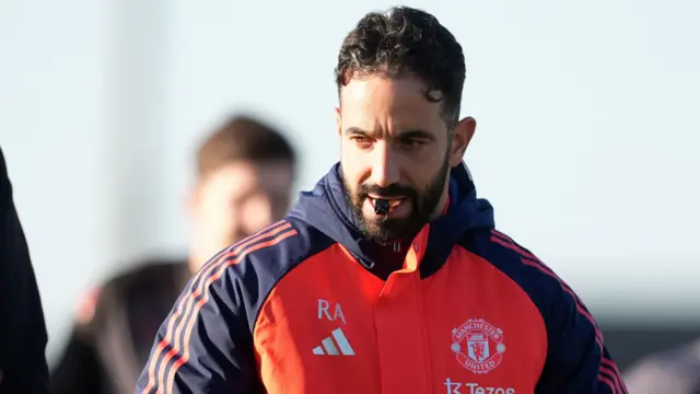 Head coach Ruben Amorim with a whistle in his mouth at Manchester United training