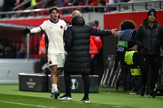 Marc Guiu of Chelsea interacts with manager Enzo Maresca