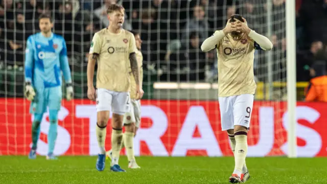 Hearts' Lawrence Shankland (R) looks dejected after his side goes 2-0 down during a UEFA Conference League 2024/25 League Phase MD4 match between Cercle Brugge and Heart of Midlothian at the Jan Breydel Stadium