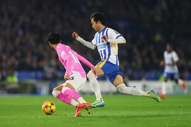 Kaoru Mitoma of Brighton & Hove Albion tackles Yukinari Sugawara