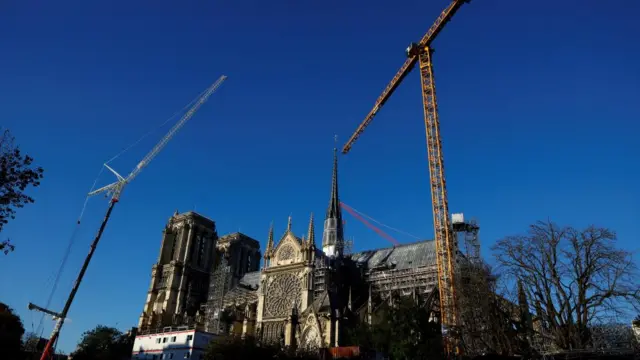 Cranes are seen around the Notre-Dame de Paris Cathedral, which was ravaged by a fire in 2019, as restoration works continue before its reopening, in Paris, France, October 23, 2024