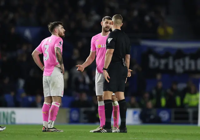 Referee, Robert Jones explains to a disappointed looking Jack Stephens of Southampton why Cameron Archer of Southampton's goal is disallowed