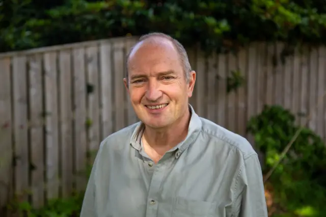 Mark Bonnington is pictured in his garden