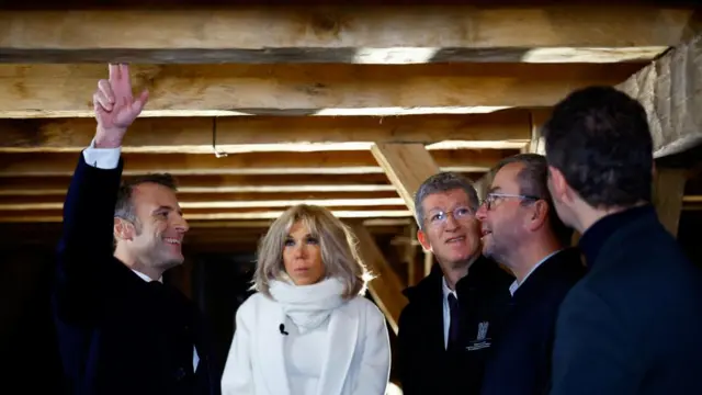 President Macron's group inside the roof of the cathedral.