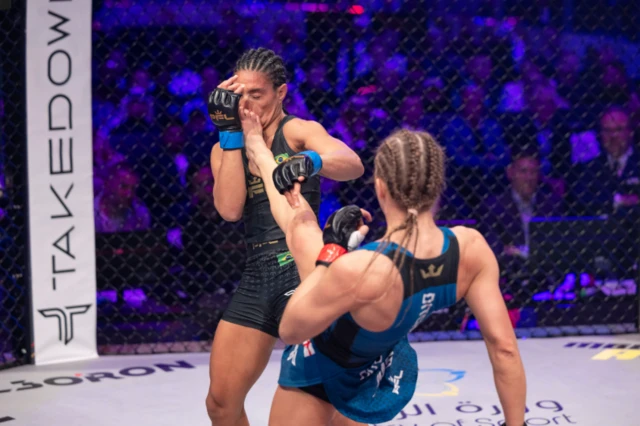 Dakota Ditcheva lands a kick to the front of Santos' face