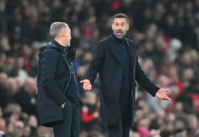 Ruud van Nistelrooy, former Interim Head Coach of Manchester United interacts with Steve Cooper, former Manager of Leicester City