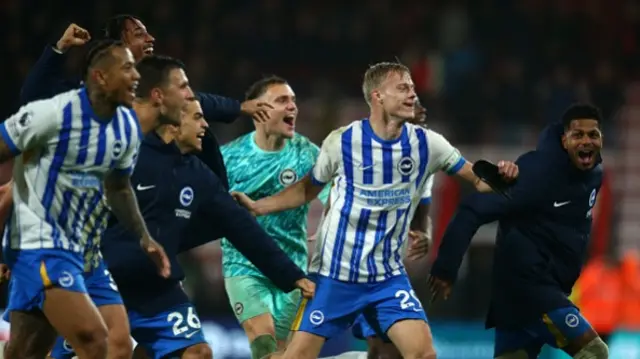 Jan Paul van Hecke of Brighton & Hove Albion leads the team in post match celebrations