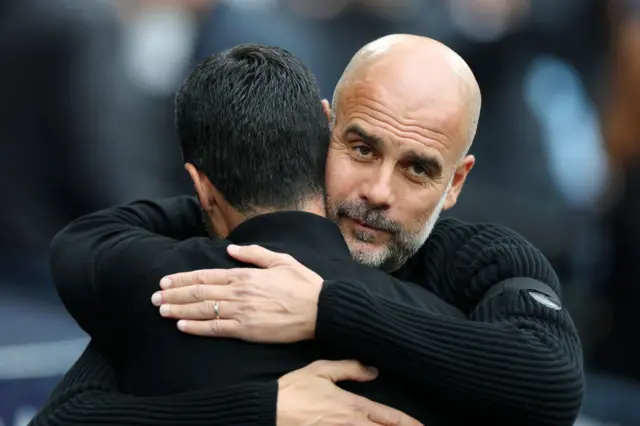 Mikel Arteta hugs Pep Guardiola