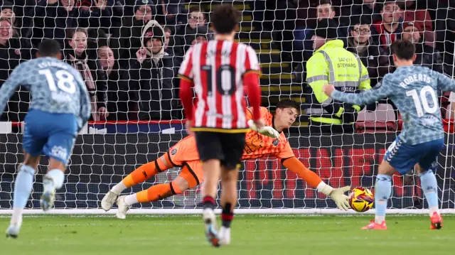 Michael Cooper saves a penalty