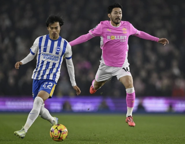 Brighton & Hove Albion's Kaoru Mitoma in action with Southampton's Yukinari Sugawara