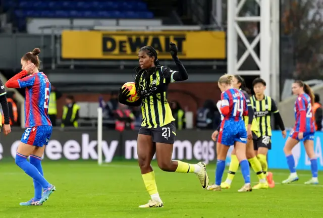 Bunny Shaw runs back to kick off with the ball after scoring