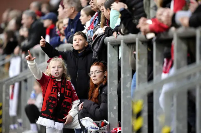 Fans cheer on United from the stands