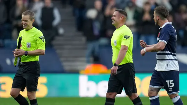 Referee Gavin Ward and Matthew Smith