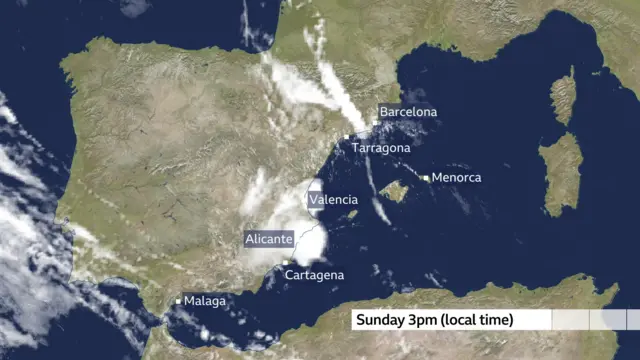 A satellite image of Spain dating to Sunday 3pm local time. Cities including Barcelona, Alicante, Malaga are labelled