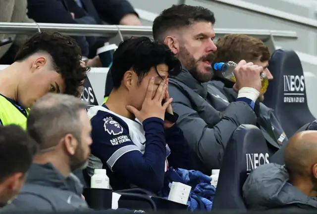 Tottenham Hotspur's Son Heung-min looks dejected on the bench after being substituted