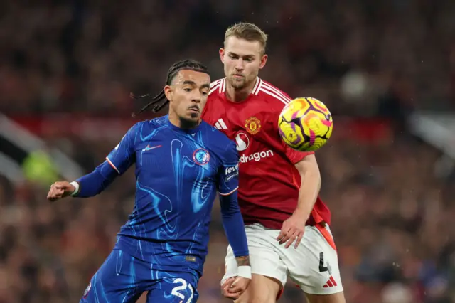 Malo Gusto of Chelsea battles for possession with Matthijs de Ligt