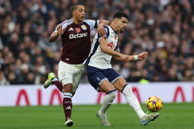 Youri Tielemans (L) vies with Tottenham Hotspur's English striker #19 Dominic Solanke (R)