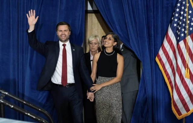 Republican U.S. vice presidential nominee Senator JD Vance and his wife Usha Vance appear on stage during his rally in Scottsdale, Arizona,