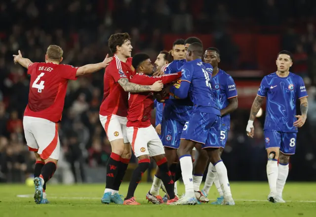 Manchester United's Amad Diallo clashes with Chelsea's Nicolas Jackso