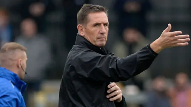 Carrick Rangers boss Stephen Baxter issues instructions to his players at Taylors Avenue