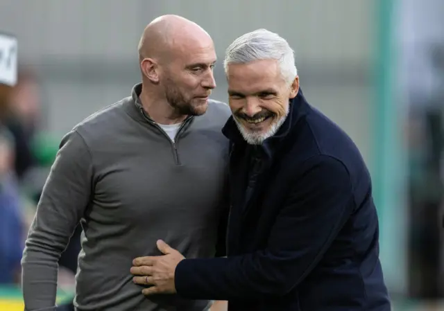 Hibernian head coach David Gray and Dundee United manager Jim Goodwin share a laugh before kick-off