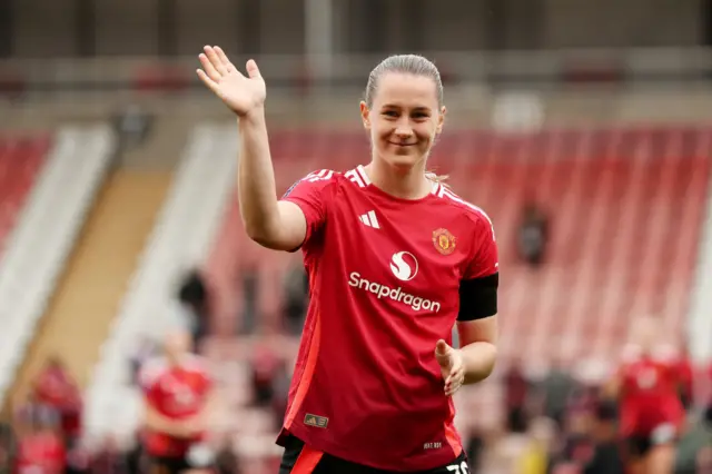 Elisabeth Terland of Manchester United waves