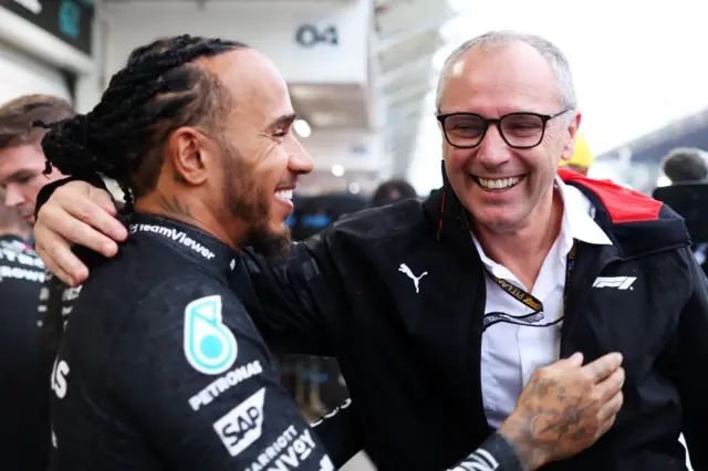 Lewis Hamilton and  Stefano Domenicali