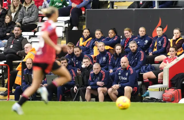 United subs look on from the bench