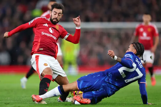 Bruno Fernandes of Manchester United and Malo Gusto of Chelsea