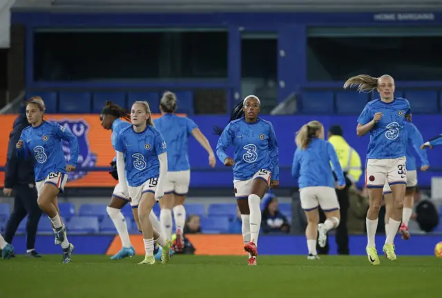 Chelsea players do a running drill in their warm up