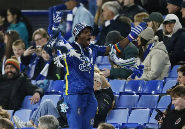 Chelsea fan shouts and cheers in the away end