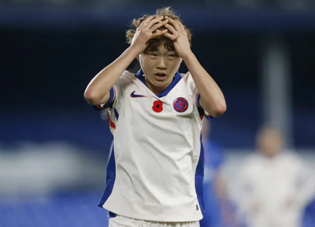 Hamano reacts to a missed chance by putting her hands to her head